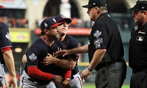 HOUSTON, TEXAS - OCTOBER 29:  Dave Martinez #4 of the Washington Nationals argues with umpire Gary Cederstrom #38 as he is ejected and is held back by Bob Henley #14 against the Houston Astros after the top of the seventh inning in Game Six of the 2019 World Series at Minute Maid Park on October 29, 2019 in Houston, Texas. (Photo by Mike Ehrmann/Getty Images) ORG XMIT: 775425079 ORIG FILE ID: 1184288825